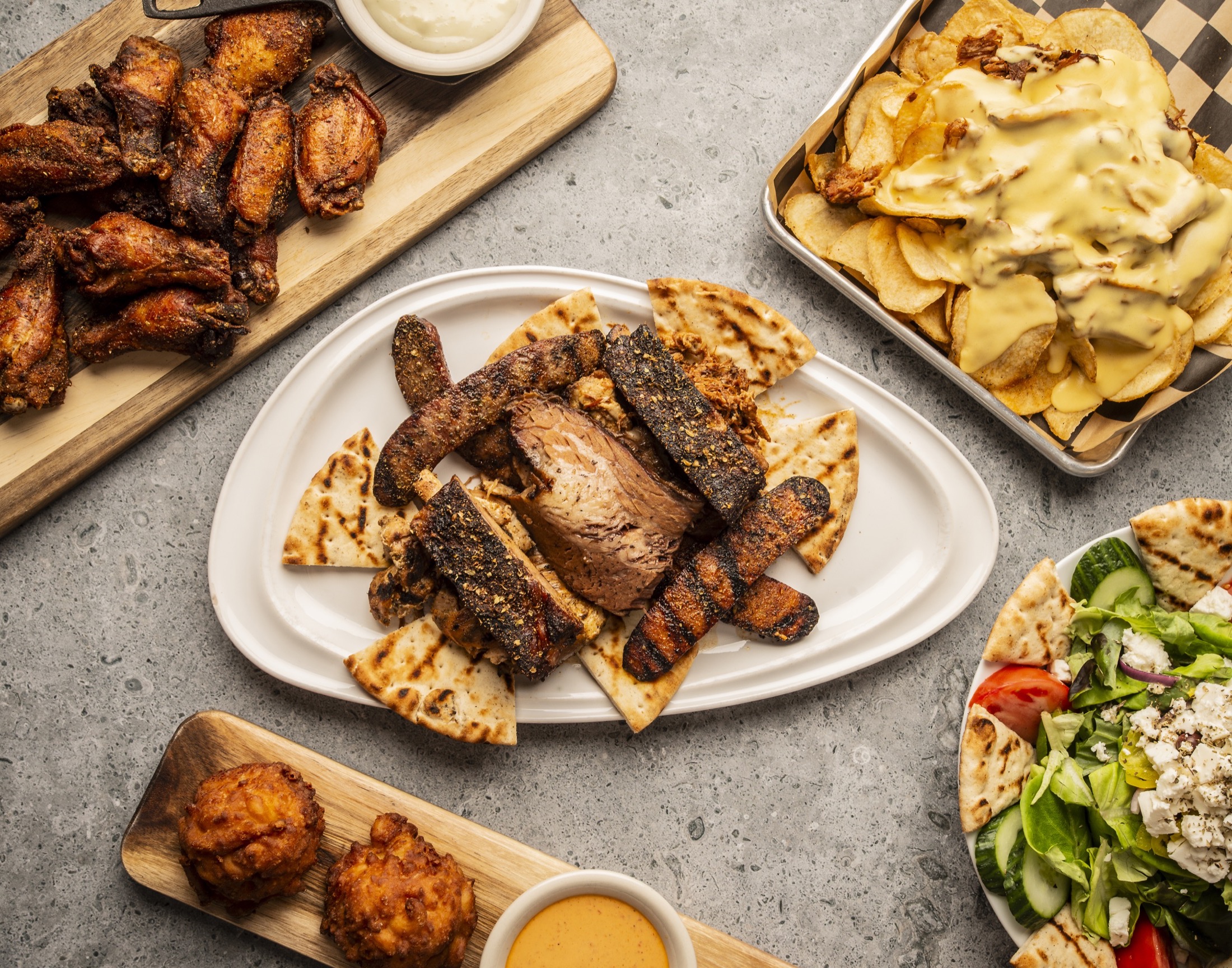 Smoky Rock BBQ catering spread with smoked meats and sides